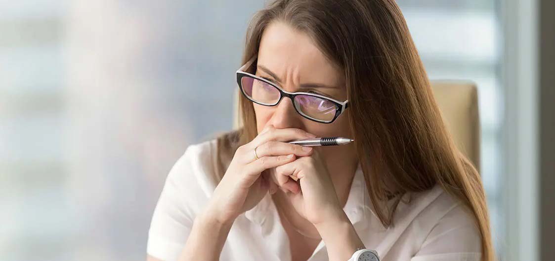 a desk worker thinking deeply