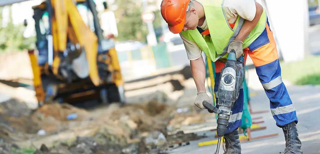 a man with a jackhammer working